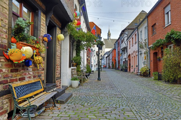 Tiefstraße decorated for Martin's procession with the tower of St. Peter's Church, Kempen, Lower Rhine, North Rhine-Westphalia, Germany