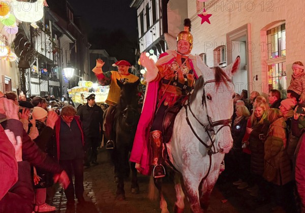 St. Martin on a white horse train in Alte Schulstraße in the evening, Altstadt, Kempen, Lower Rhine, North Rhine-Westphalia, Germany