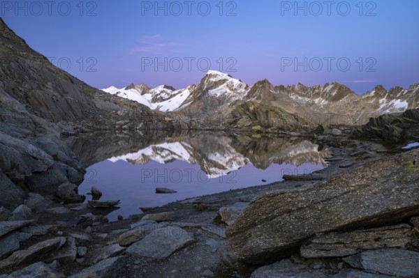 Mount Galenstock is reflected in Bergsee, Grätlisee, Canton of Valais, Switzerland
