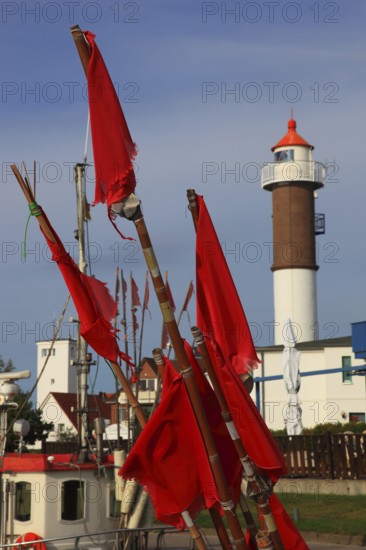 Timmendorf lighthouse on the island of Poel on the Baltic Sea, rigging and flags from a boat in the foreground, Northwest Mecklenburg district, Mecklenburg-Western Pomerania, Germany