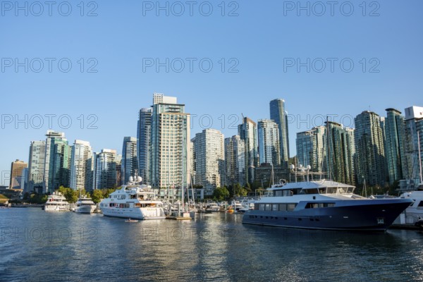 Sailing boats in marina, skyscrapers on the promenade, Coal Harbour, Vancouver, British Columbia, Canada