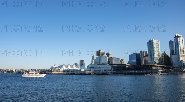 Skyline, skyscrapers and Canada Place on the promenade, Vancouver, British Columbia, Canada