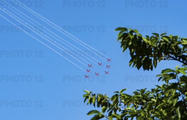 The Indian Air Force (IAF) Surya Kiran aerobatics team performs during an air show as part of the 93rd Air Force Day celebrations on November 8, 2025 in Guwahati, India