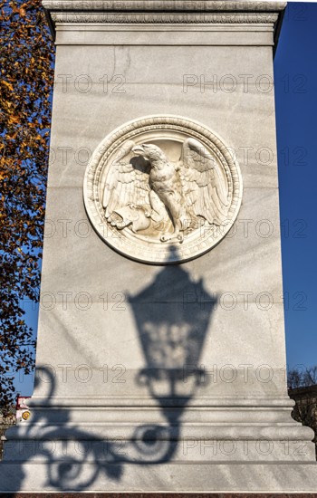 The shadow of a street lamp on the pedestals of the group of figures on the Schlossbrücke, Unter den Linden, Berlin, Germany