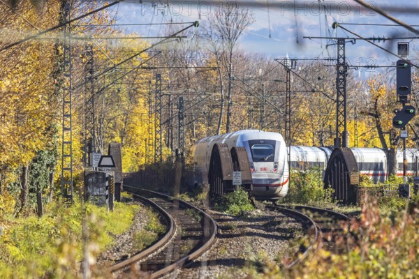 Intercity Express ICE. Open-route passenger train in the Stuttgart North Station area. Arched bridge and landscape in autumn. Stuttgart, Baden-Württemberg, Germany