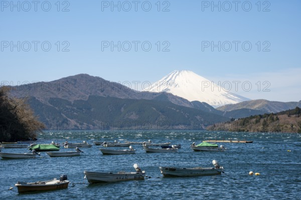 Attached rowing boats, view of Lake Ashi with Mount Fuji volcano, Hakone, Japan