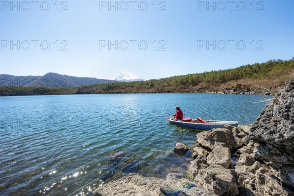 Anglers at Lake Saiko, behind volcano Mt. Fuji, Minamitsuru District, Yamanashi Prefecture, Japan