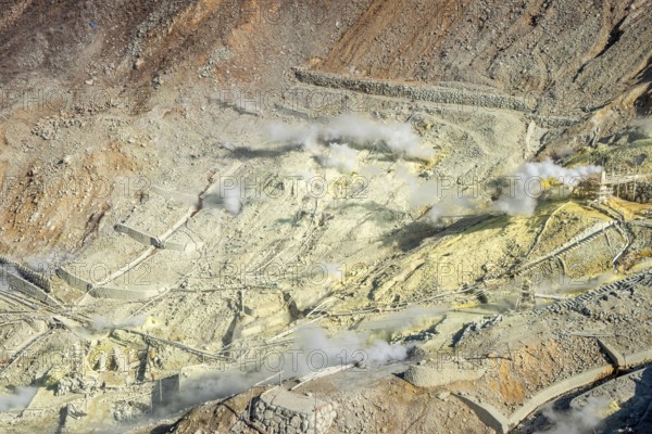 Steaming fumaroles in the Owakudani geothermal area at Komagatake volcano, Hakone, Japan