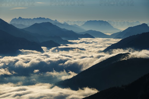 Blue-colored silhouette of mountains, fog in the valley, Wilder Kaiser and Chiemgau Alps, Upper Bavaria, Bavaria, Germany