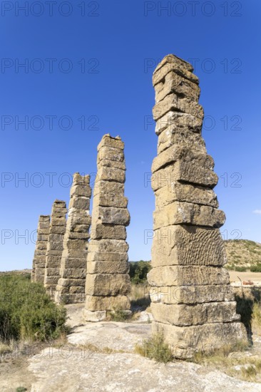Stone columns of ancient aqueduct, Roman site of Los Banales, near Layana, Zaragoza province, Aragon, Spain