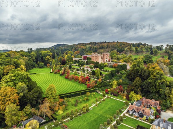 Autumn colours over Powis Castle and Garden from drone, Welshpool, Powys, Wales, England, United Kingdom