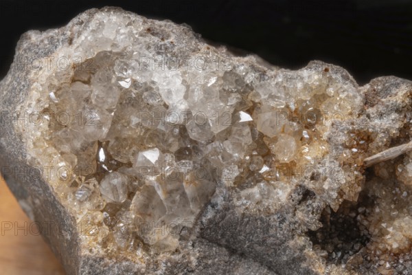 Vibrating quartz crystals mix with rock formations and capture light in a natural spring atmosphere. Geological diversity attracts the interest of enthusiasts