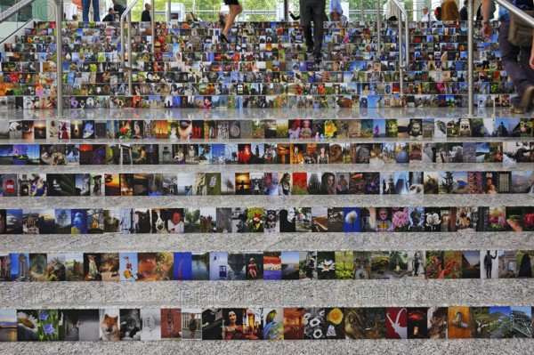 People walking on a staircase with covered photos, Photokina 2012, Messeplatz 1, Cologne, North Rhine-Westphalia, Germany