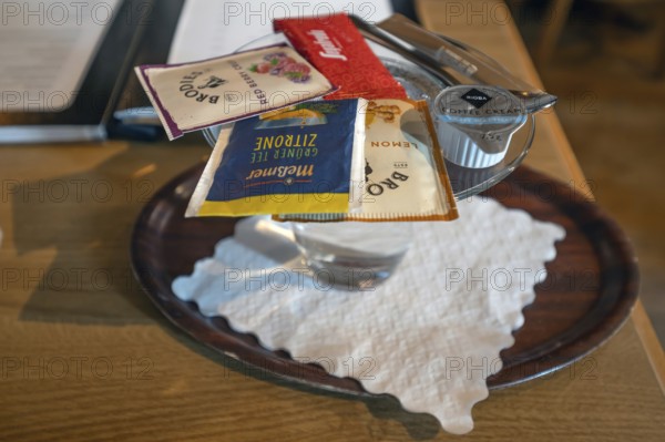 Selection of fruit teas served with a hot glass of water, Franconia, Bavaria, Germany