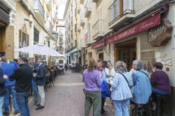 People outside tapas bars in El Tubo area of the Old Town, Zaragoza, Aragon, Spain