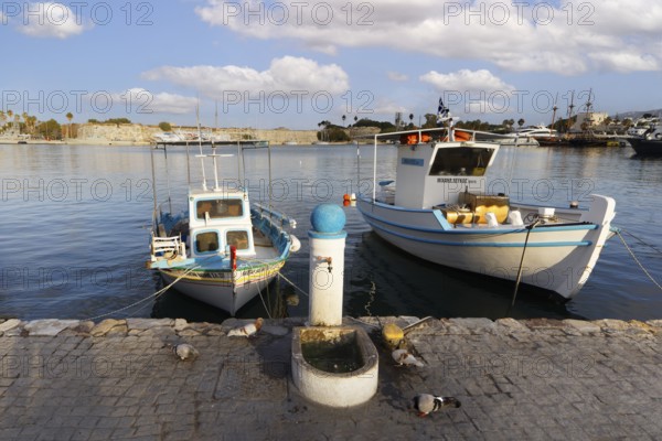 Fishing boat, fishing boats, picturesque, Neratzia fortress in the back, Mandraki harbor, seaport, old town, Kos town, Kos island, Dodecanese islands, Greece, eastern Adriatic Sea, Mediterranean