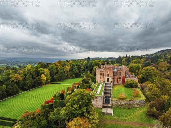 Autumn colours over Powis Castle and Garden from drone, Welshpool, Powys, Wales, England, United Kingdom