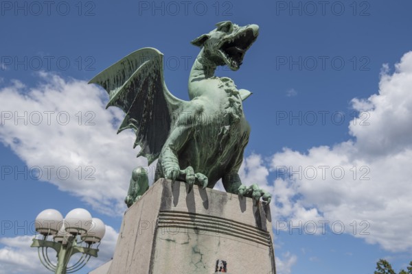 Green dragon statue on Dragon Bridge (Zmajski Most) in Ljubljana, Slovenia