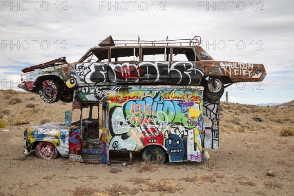 Goldfield, Nevada - The International Car Forest of the Last Church. Artist Mark Rippie has partially buried or decorated several dozen junk cars