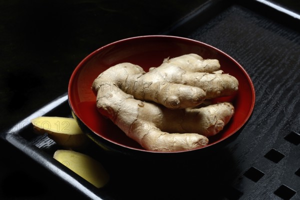 Ginger, ginger root in tea bowl, Zingiber officinale, tea preparation