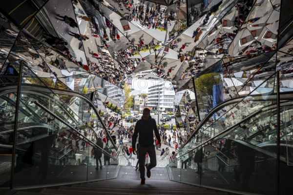 Young man on a stairway, entrance to a shopping center with many mirrors, Tokyu Plaza Omotesando Harajuku, modern architecture, Tokyo, Japan