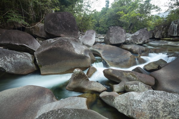 Turquoise blue water between rocks in the tropical rainforest of Babinda Boulders Queensland Australia