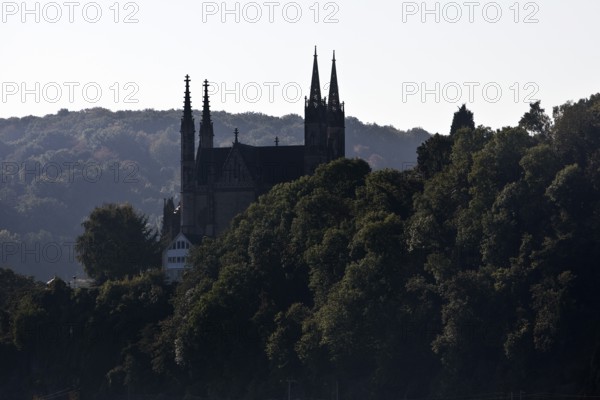 Pilgrimage Church of St. Apollinaris, also Apollinaris Church on Apollinarisberg in Remagen looking back as a silhouette, Rhineland-Palatinate, Germany