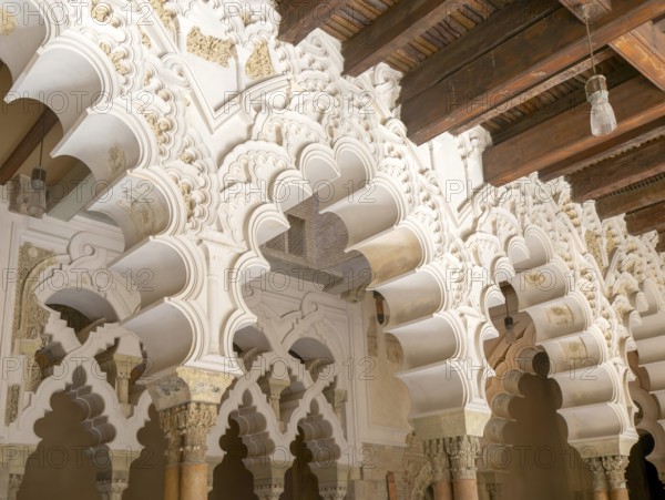 Ornate Islamic design of decorated Moorish arches, Aljafería Palace, Zaragoza, Aragon, Spain
