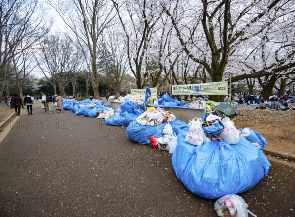Large piles of trash at a garbage collection point, garbage bags, Yoyogi Park, Hanami Festival, Shibuya District, Tokyo, Japan