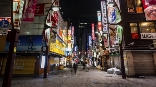 Pedestrian street with neon sign, long exposure, street scene at night, Tokyo, Japan