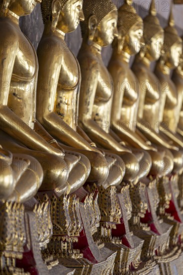 Gilded Buddha statues (Bhumispara mudra: Buddha Gautama at the moment of enlightenment), Wat Suthat Thepwararam, Royal Temple, Phra Nakhon, Bangkok, Thailand