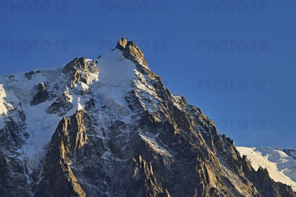 Snowy Aiguille du Midi in the evening light, Mont-Blanc, Chamonix-Mont-Blanc, Haute-Savoie, France