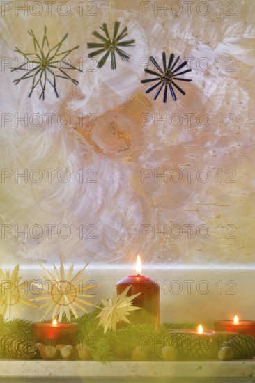 Christmassy decorated iced window, candle light, straw stars, Germany