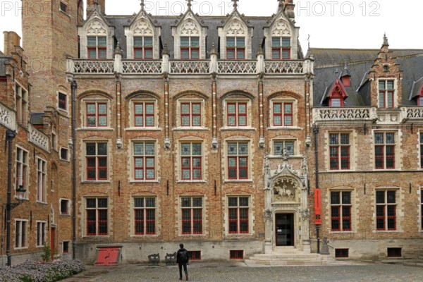 Gruuthusemuseum with equestrian statue of Lodewijk van Gruuthuse above the entrance portal in the historic old town of Bruges, UNESCO World Heritage Site, Flanders, Belgium