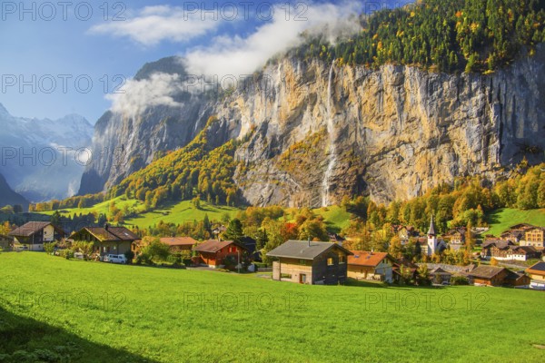 View of town and valley with Staubbach waterfall in autumn, Lauterbrunnen, Bernese Oberland, Canton of Bern, Switzerland