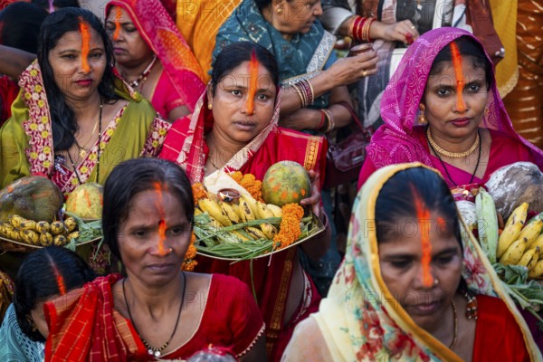 Hindu devotees offer prayers to the Sun God on the bank of Brahmaputra river on the occasion of Chhath Puja, in Guwahati, India on 27 October 2025