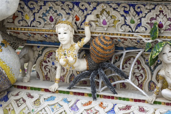 Decorative elements with pop culture references (for example comics, superheroes) in the stucco and porcelain vases outside and inside the art hall with modern art trends such as minimalism and abstraction, Wat Pariwat, Yan Nawa district, Bangkok, Thailand