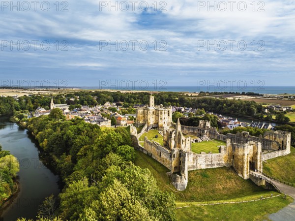 Warkworth Castle over River Coquet from a drone, Warkworth, Northumberland, England, United Kingdom