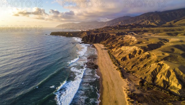 Desert landscape converges with ocean along a rugged coastal area, shore break at cliffs, blue cloudy sky at sunset, dry landscape in an aerial drone view, AI generated