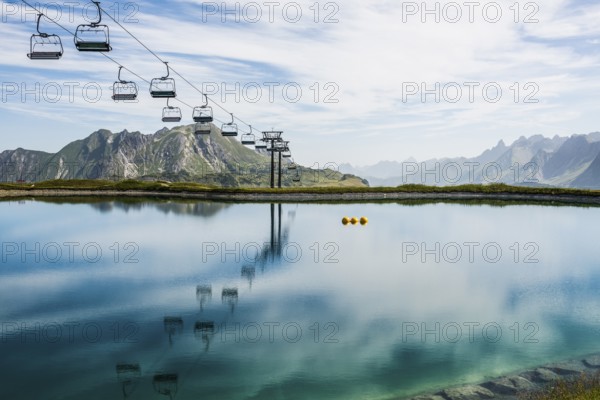 Mountain landscape with reservoir and chairlift, Saloberkopf, Warth, Bregenzerwald, Vorarlberg, Alps, Austria