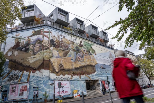 The Bilker Bunker, former air raid shelter from 1944, is a listed building, used as a cultural institution since 2023, exhibitions, concerts, events, gastronomy, mural time travelers, on the roof there are 5 cubes with apartments, private property, conversion of civil protection areas, Düsseldorf, North Rhine-Westphalia, Germany