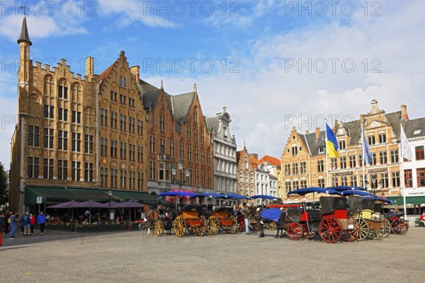 Historic houses on the market square in the old town of Bruges with horse-drawn carriages, Grote Markt, UNESCO World Heritage Site, Flanders, Belgium