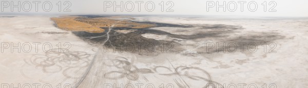Aerial view, tire tracks on a salt pan, arid landscape, Botswana
