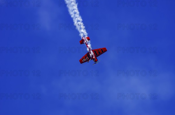 A Soviet Jakovlev Jak-55 sport aircraft with the registration LY-TOY during a flight demonstration as part of an air show on Rossfeld in Metzingen-Glems, Baden-Württemberg, Germany, for editorial use only