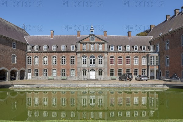 16th century Classicist Château de Franc-Waret in Louis XV style, moated castle in the village Fernelmont, province of Namur, Wallonia, Belgium
