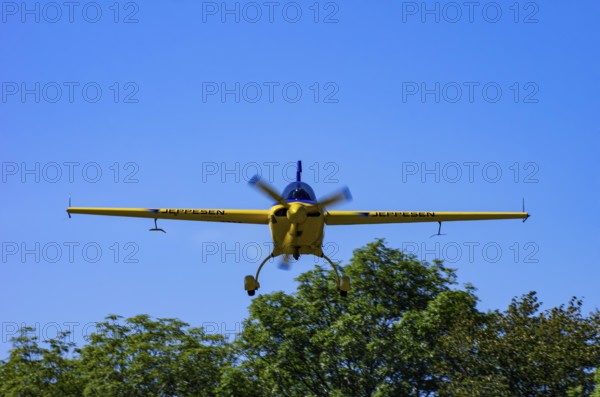 An Extra EA-300 from Extra Flugzeugproduktions- und Vertriebs GmbH with registration D-EXBH during a flight demonstration as part of an air show on Rossfeld in Metzingen-Glems, Baden-Württemberg, Germany, for editorial use only