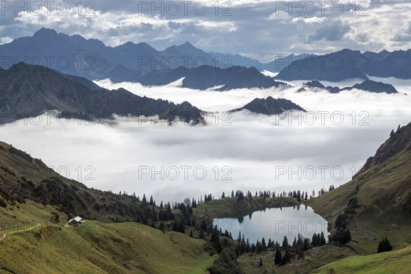 View of Seealpsee and Allgäu Alps, mountains rising from fog in the valley, Nebelhorn, Oberstdorf, Oberallgäu, Allgäu, Bavaria, Germany