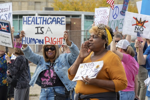 Detroit, Michigan USA - 18 October 2025 - Protesters from Detroit and Grosse Pointe gathered on the border between their cities for a 'No Kings' rally, protesting President Trump's actions against immigrants and against democratic institutions