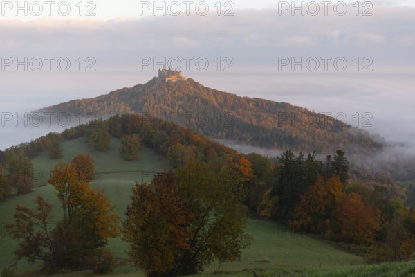 Hohenzollern Castle in a sea of fog at sunrise, autumn in the Swabian Jura