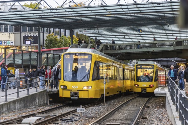 Wilhelmsplatz Bad Cannstatt stop, Stuttgarter Strassenbahnen AG, SSB. Platform with passengers. Stuttgart, Baden-Württemberg, Germany